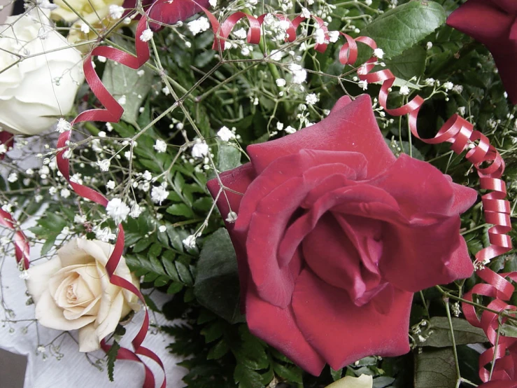 an arrangement of flowers arranged on a table