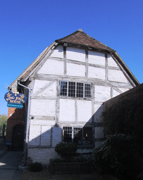 a white building with a sign on the front