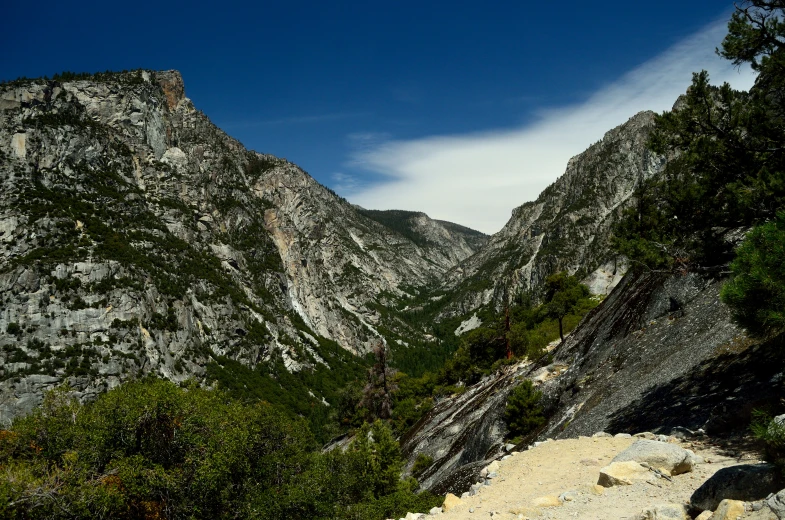 an image of a mountain with rocks and vegetation
