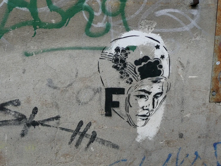 graffiti on a wall with a man's head