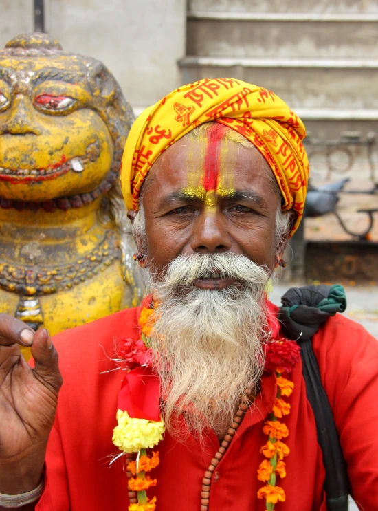 a man dressed up with a yellow crown and a beard