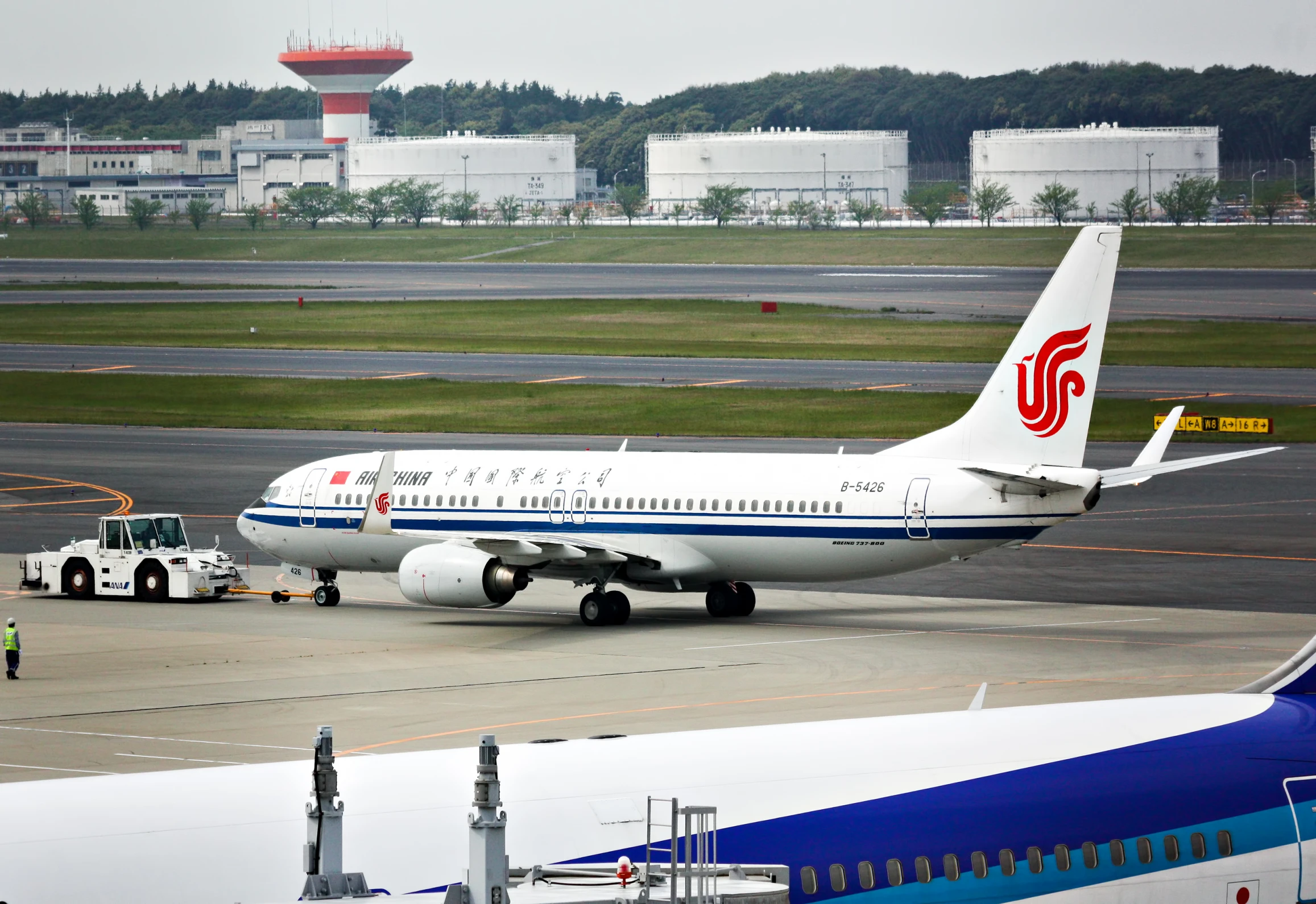 a large airplane parked on the tarmac in an airport