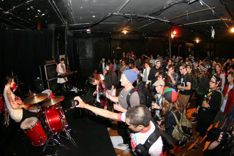 a band plays music in front of an audience