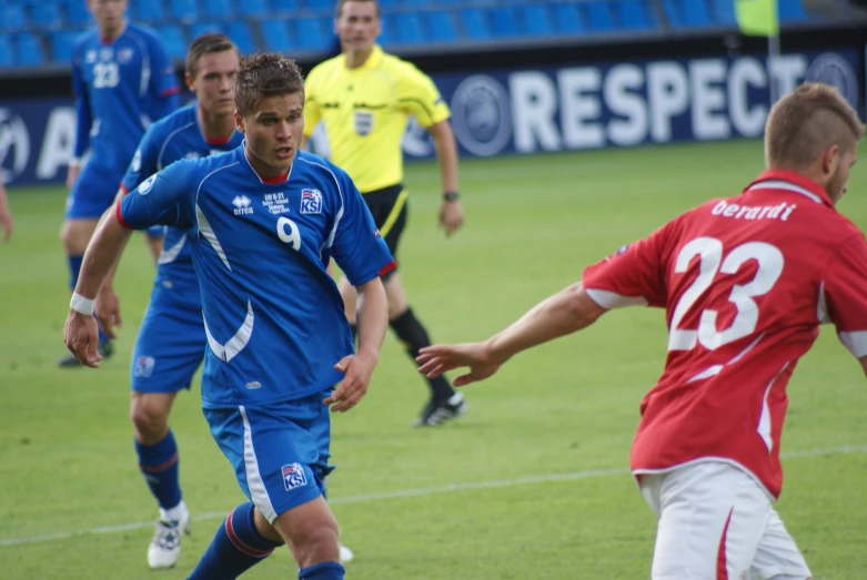 a group of young men playing a game of soccer