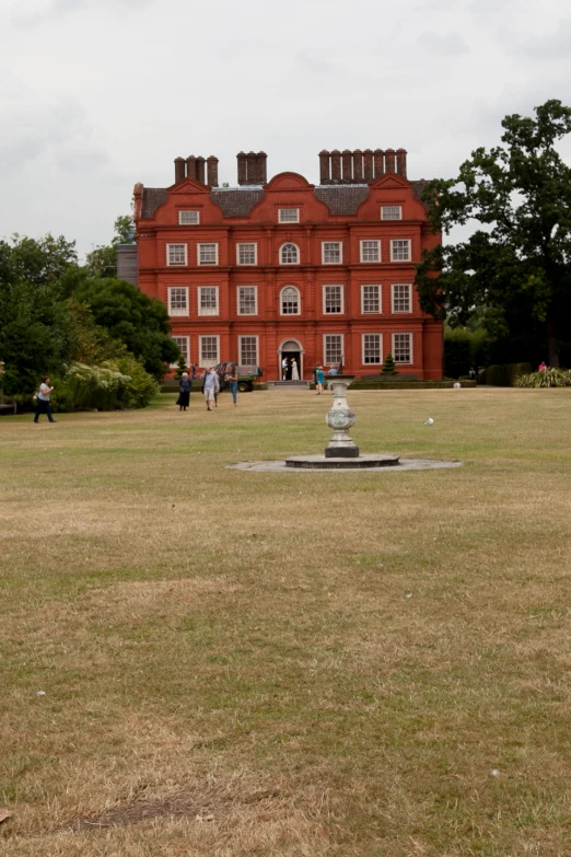 a red building with three chimneys and two story