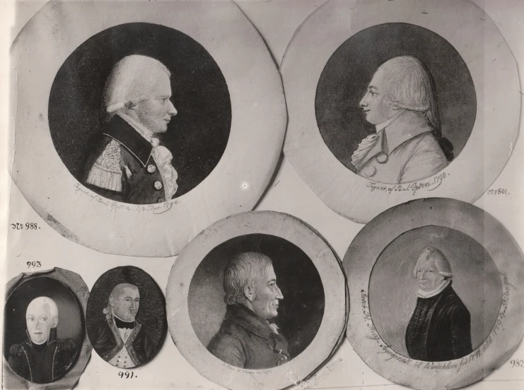 a black and white po of five different heads