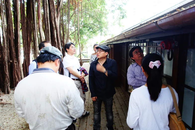 a group of people gathered around a small area