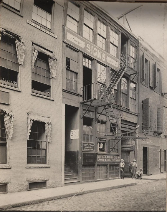 an old po of several tall buildings in the early 1900's