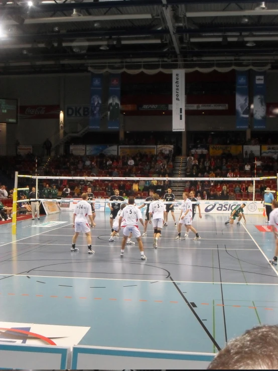 a group of men playing a game of volleyball