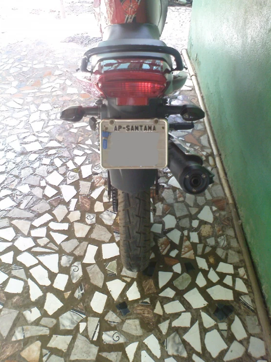 an image of a motorcycle that is parked in the rain