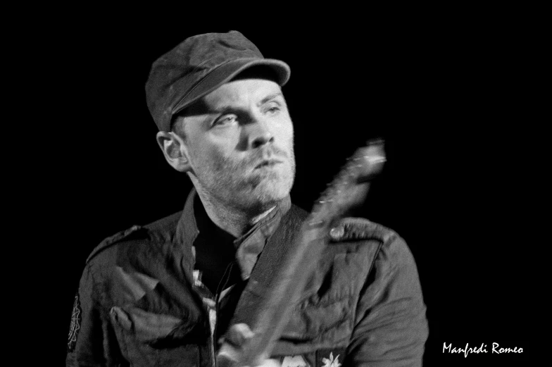 black and white pograph of a man with baseball cap