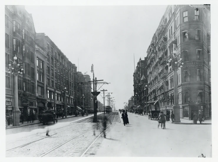 two people walking down a snow covered street