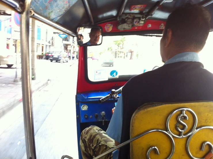 a person riding on a public transit bus