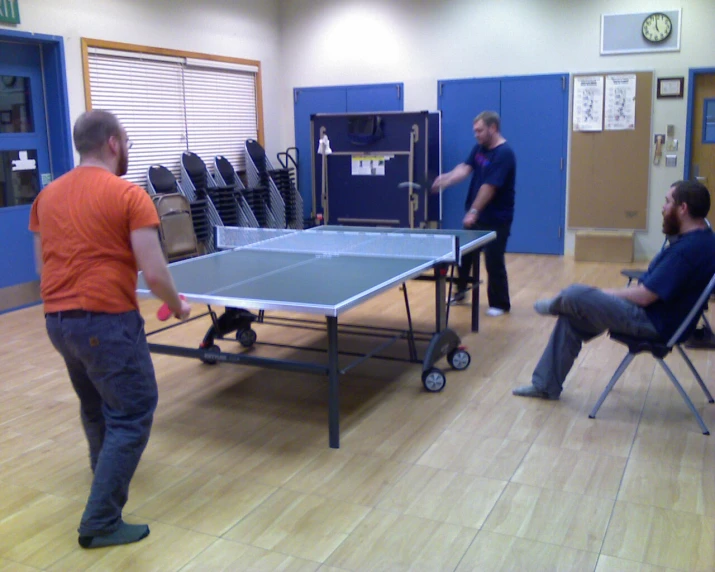 two men play a game of ping pong