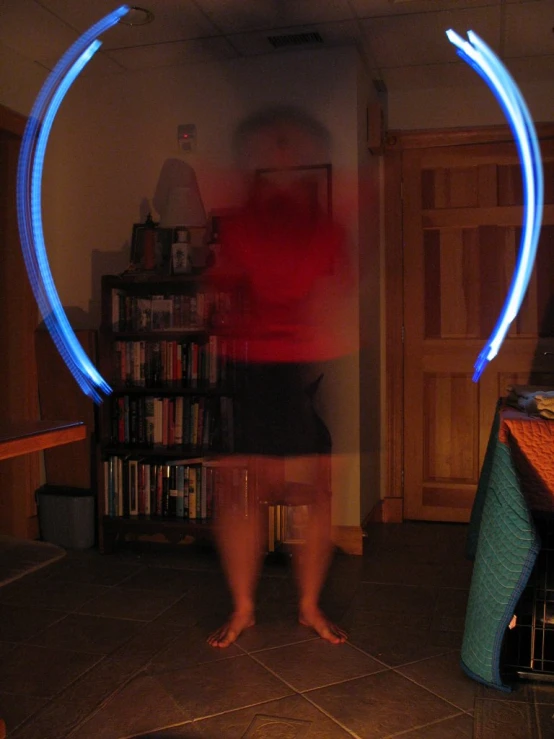 a person is shown behind a blue light