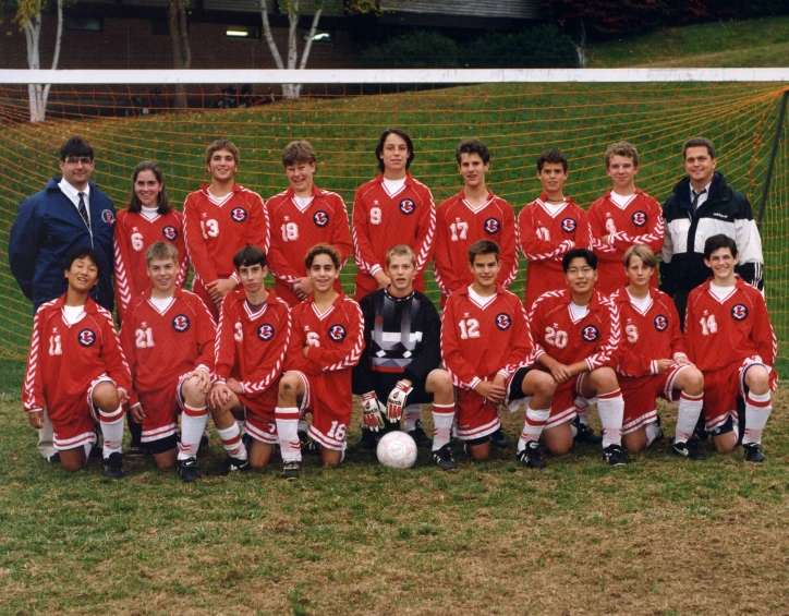 a group of s are posing for a soccer team