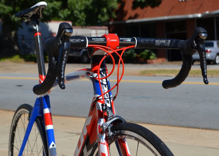 the bike has red, white and blue stripes on it