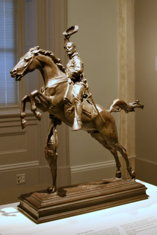 a statue is shown with a person riding on a horse