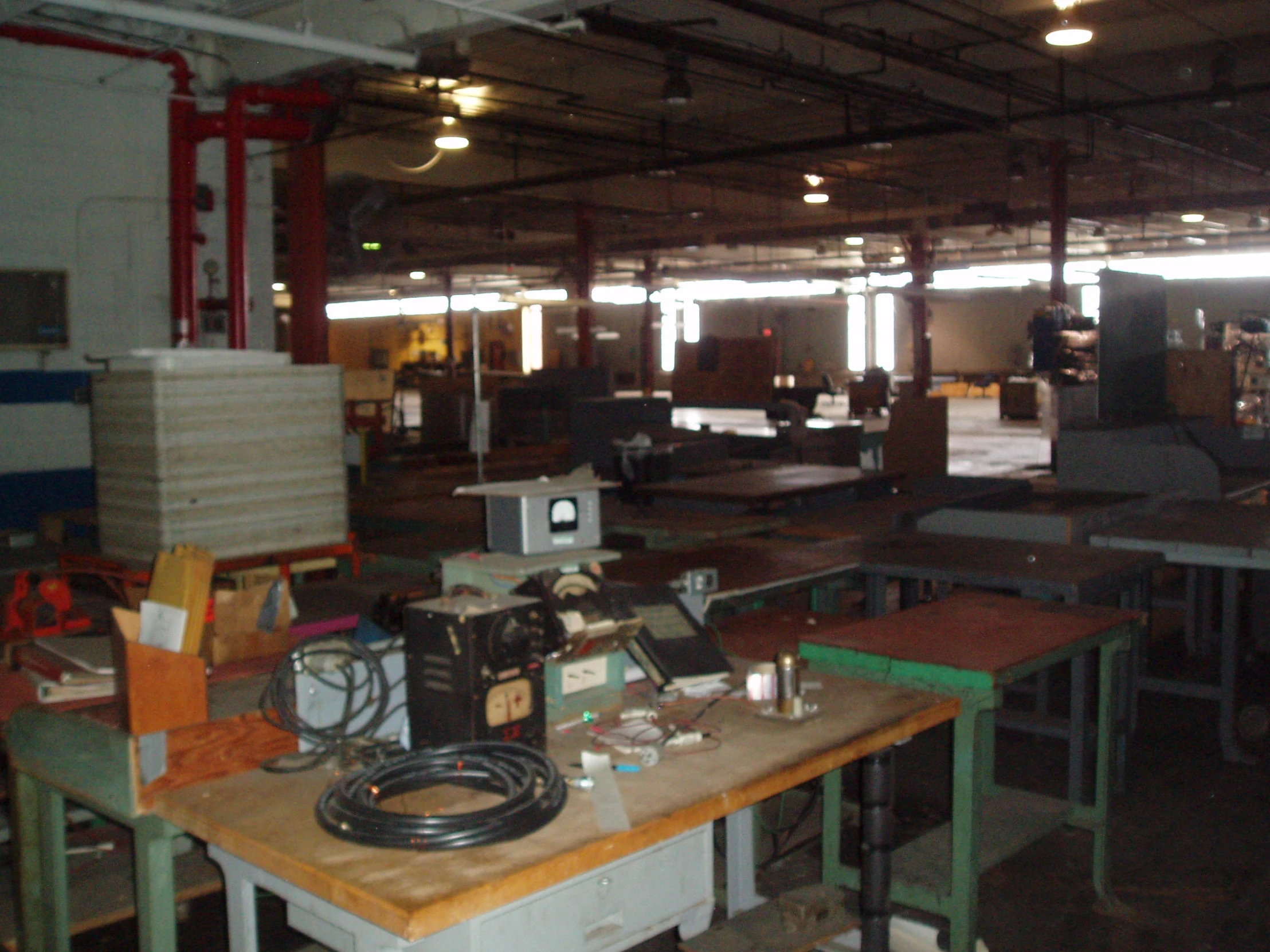 a large room filled with lots of computers and other desks