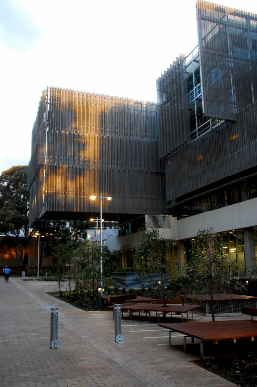 there are many benches by the windows of this building