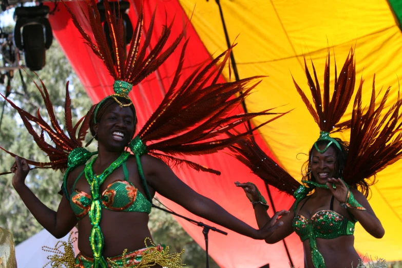 two young women dressed in elaborate outfits