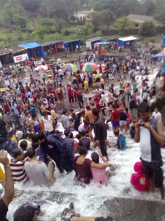 a group of people that are sitting in the water