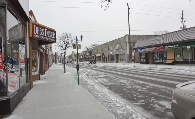 some stores a sign snow and buildings