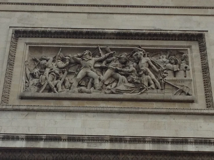 the relief of an image on the side of a building