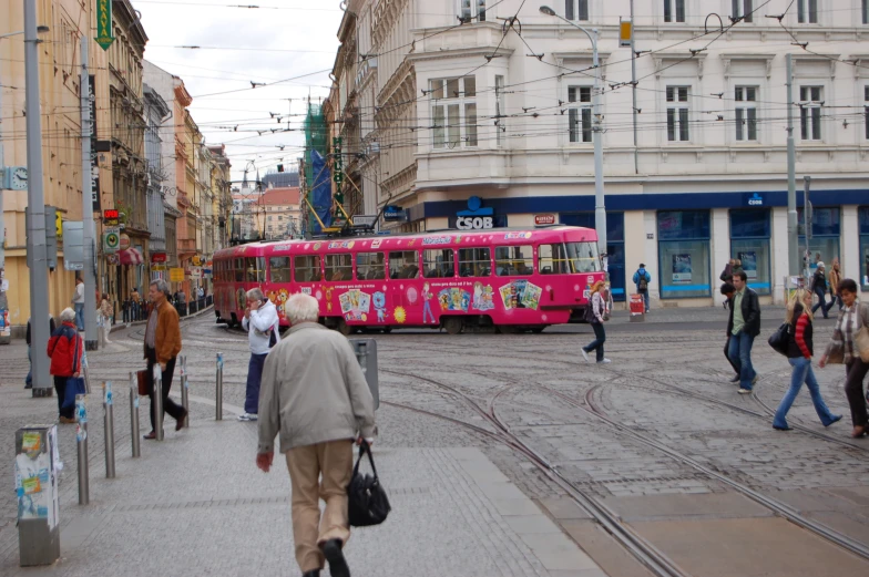 a colorful bus that is driving on the street