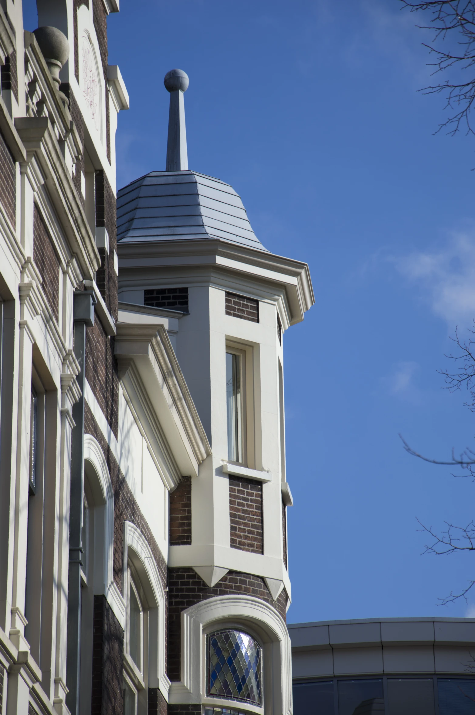 a tall clock tower sitting next to a building