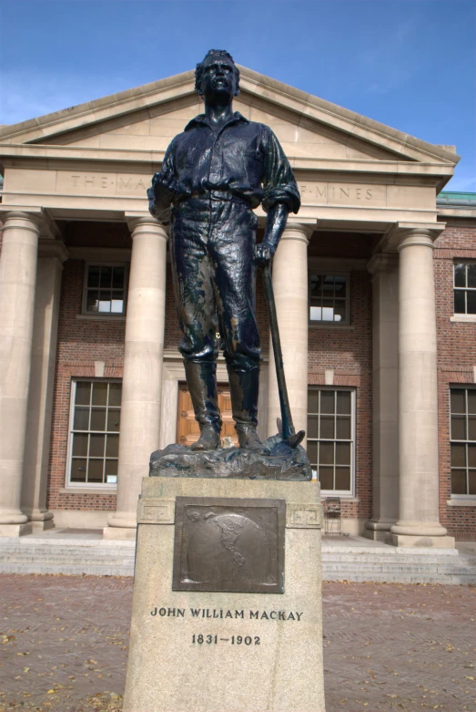 a statue is standing outside of the building