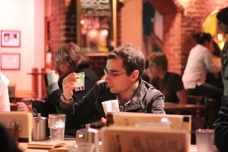 man takes a picture of himself at restaurant