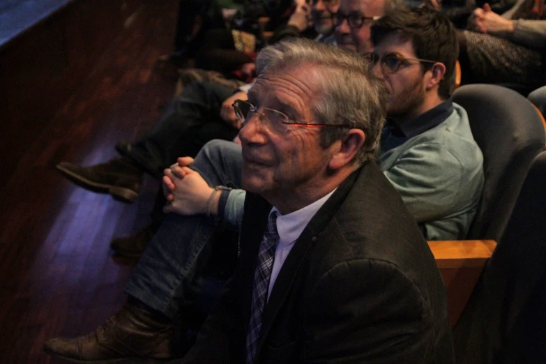 many people are in the audience while sitting down