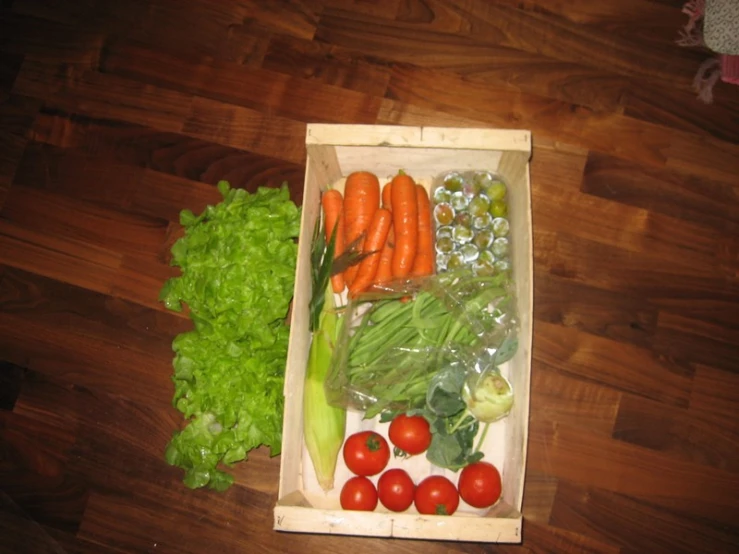 a box that is filled with veggies sitting on top of a table