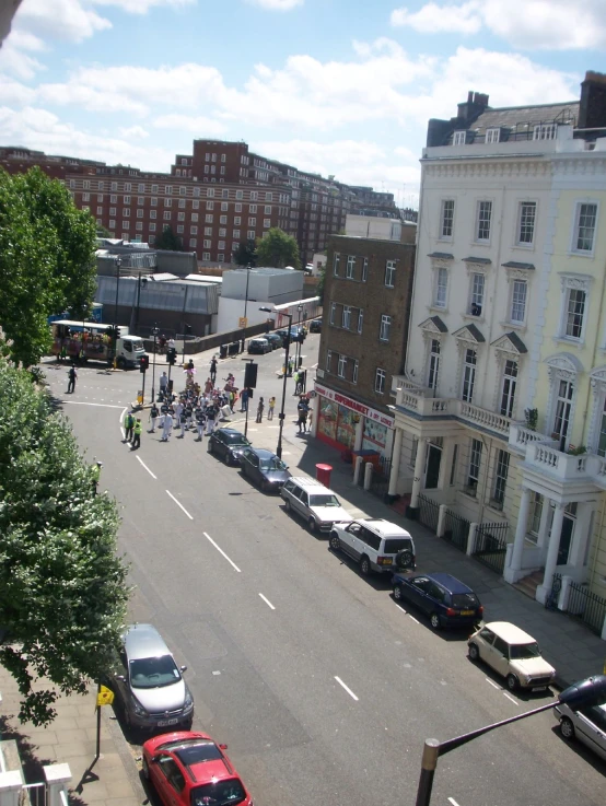 people are riding their bicycles down the street on a bike