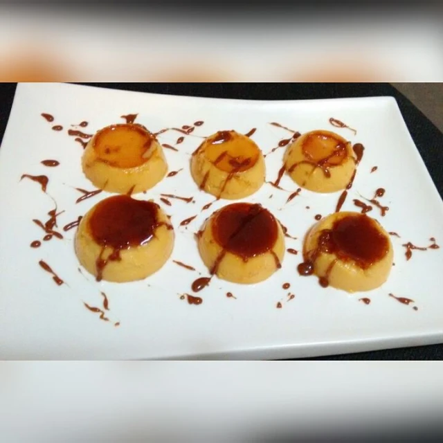 four pieces of pastry sit on a white plate