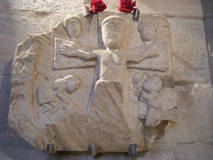 sculptures on the outside of a building made from cement