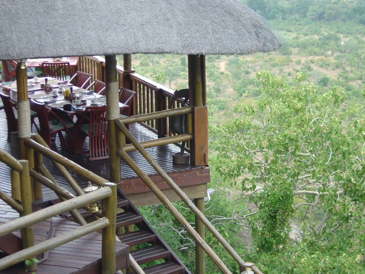 a wooden staircase leading to an over head restaurant