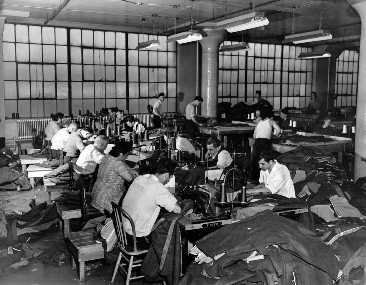 a large room full of people working on sewing machines