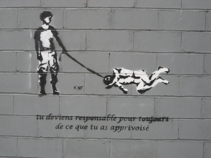graffiti drawn on the side of a wall depicting a person walking a dog with his hand