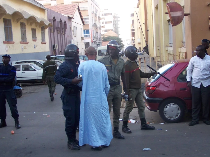 group of people wearing surgical garb and helmets