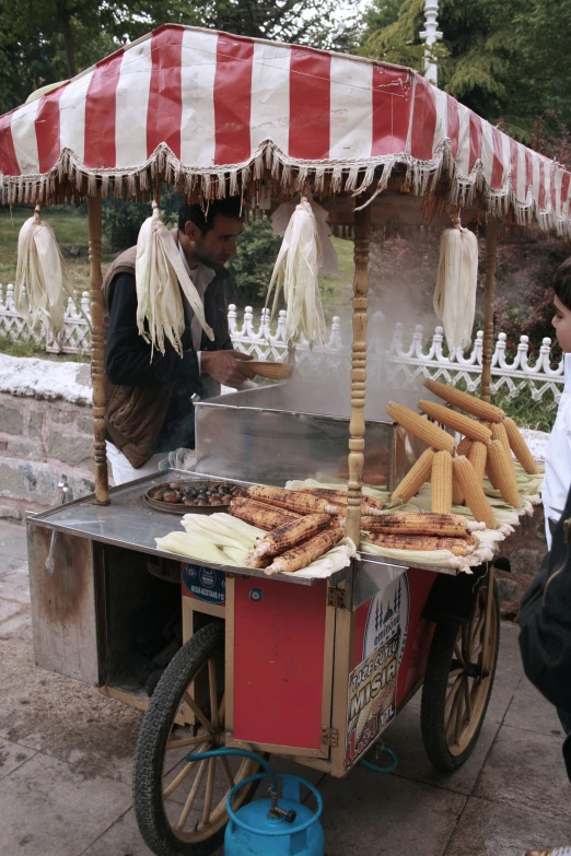 an image of people cooking on the grill