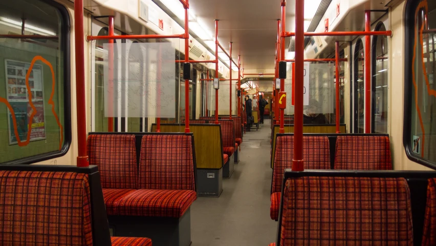 the interior of an empty train car is pictured