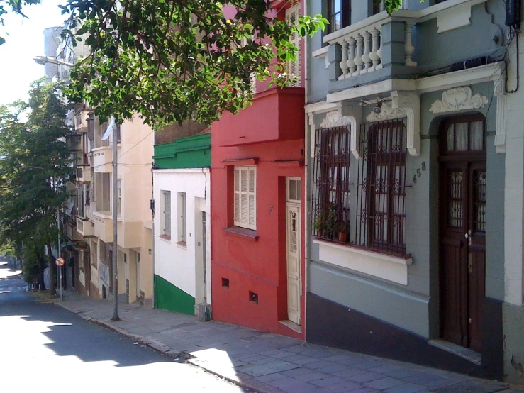 the buildings along this road are painted in different colors