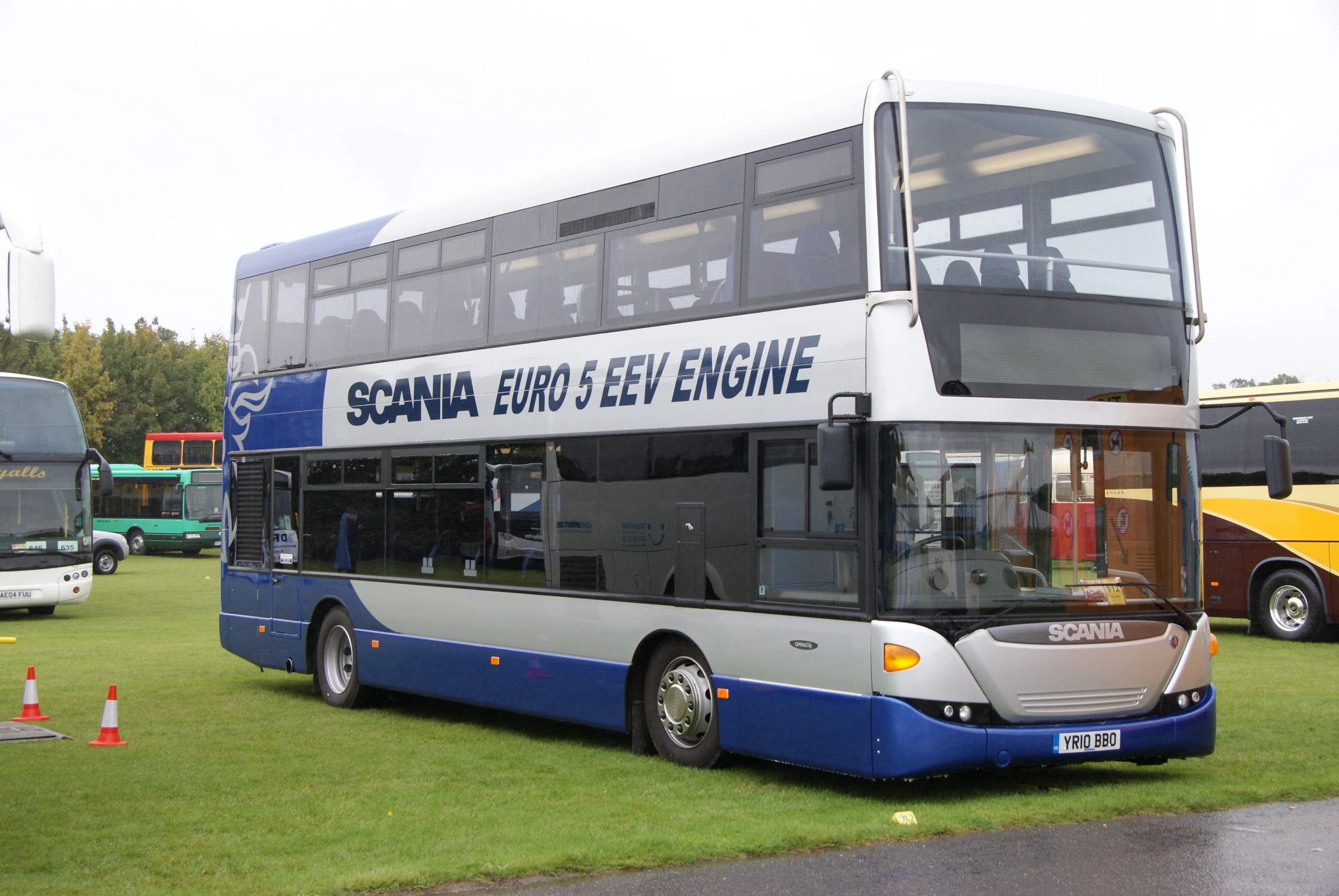 an image of a bus that is parked in the grass