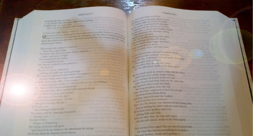 an open book with pages spread on a table