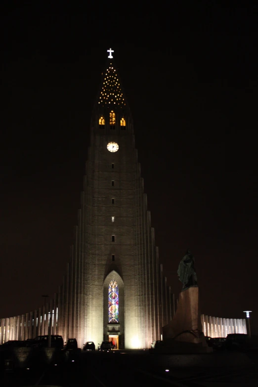 a large steeple with a light up cross