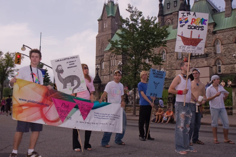 some people walking in the street with banners