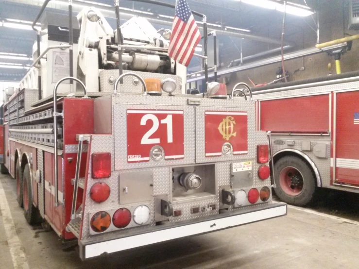 two fire trucks parked in a garage