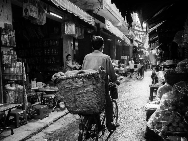 people are riding bikes in an alley